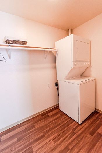 Small laundry room with shelf